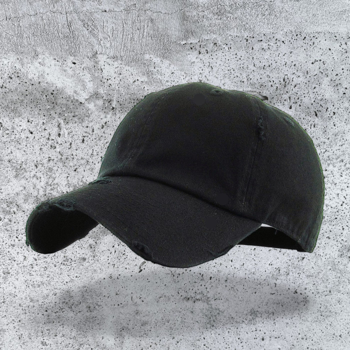 KB unstructured baseball cap, black distressed cotton low profile crown, front left view on textured background
