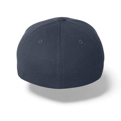 Flexfit baseball cap, navy blue wicking stretch fabric with extra deep crown, rear view showing eyelets on white background.