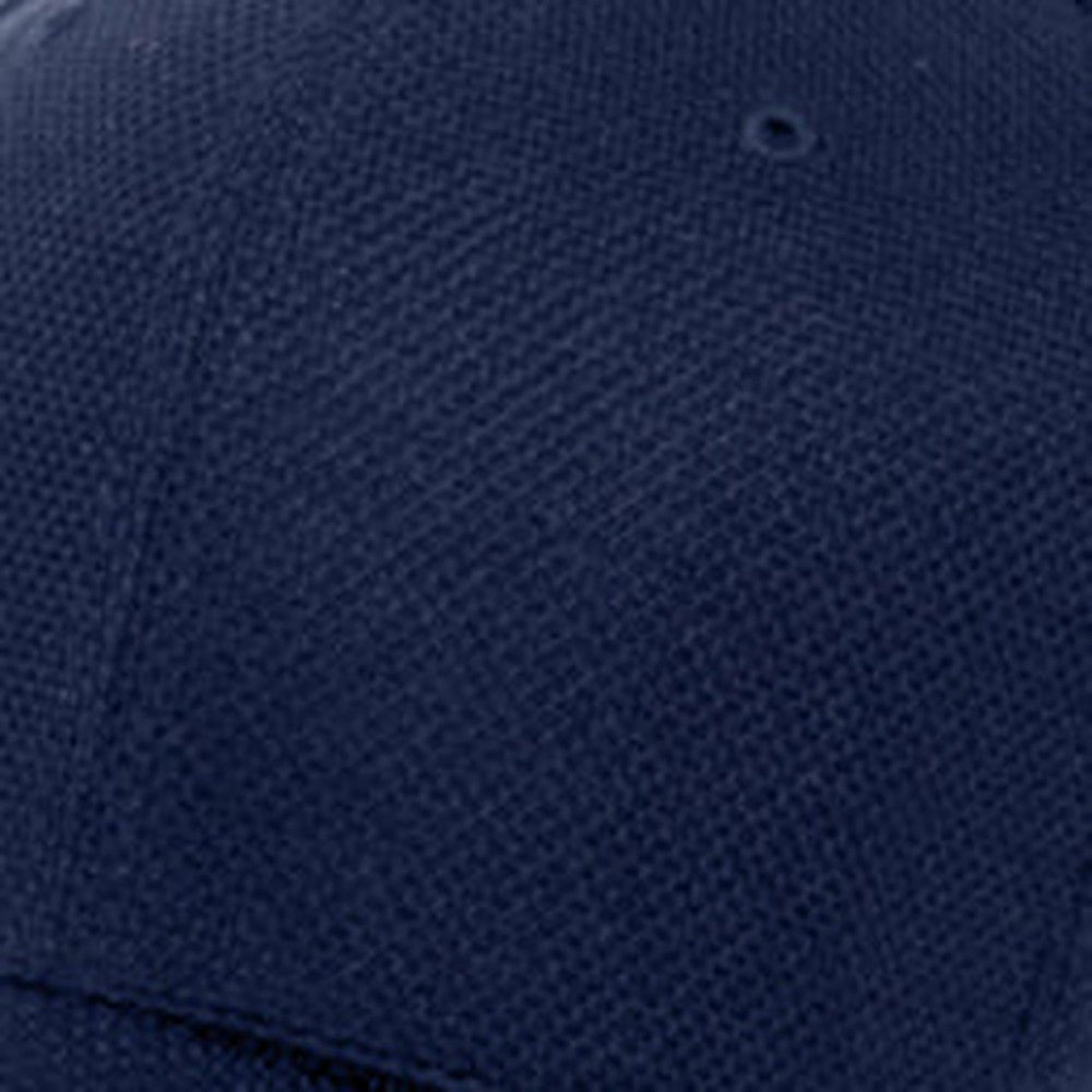 Flexfit baseball cap, navy blue stretch wicking fabric with extra deep crown, fabric closeup view.